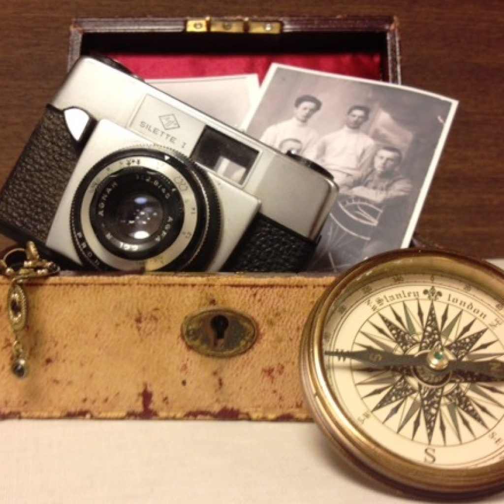 vintage camera, compass and family photos