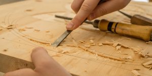 person doing woodwork