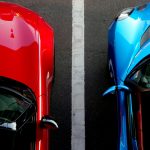 blue and red car parked side by side vehicle storage