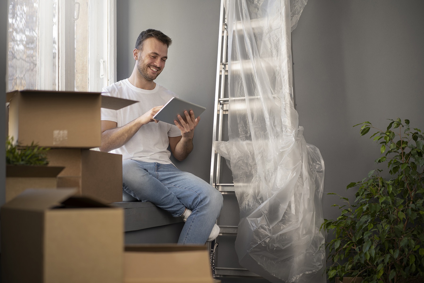 Man with tablet with boxes